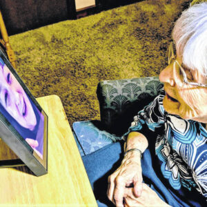 Elderly Woman Video Calling Family
