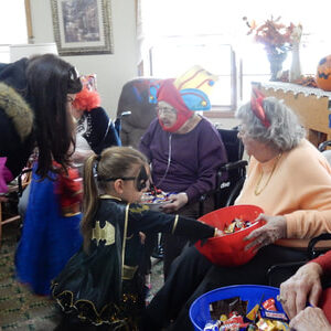 Elderly Women Handing Out Halloween Candy