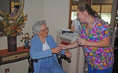 Nurse Caring For Elderly Resident